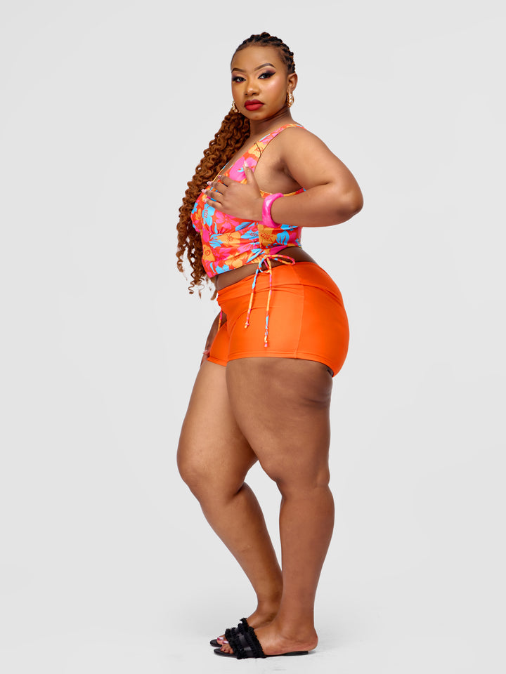 Tankini vest with orange shorts