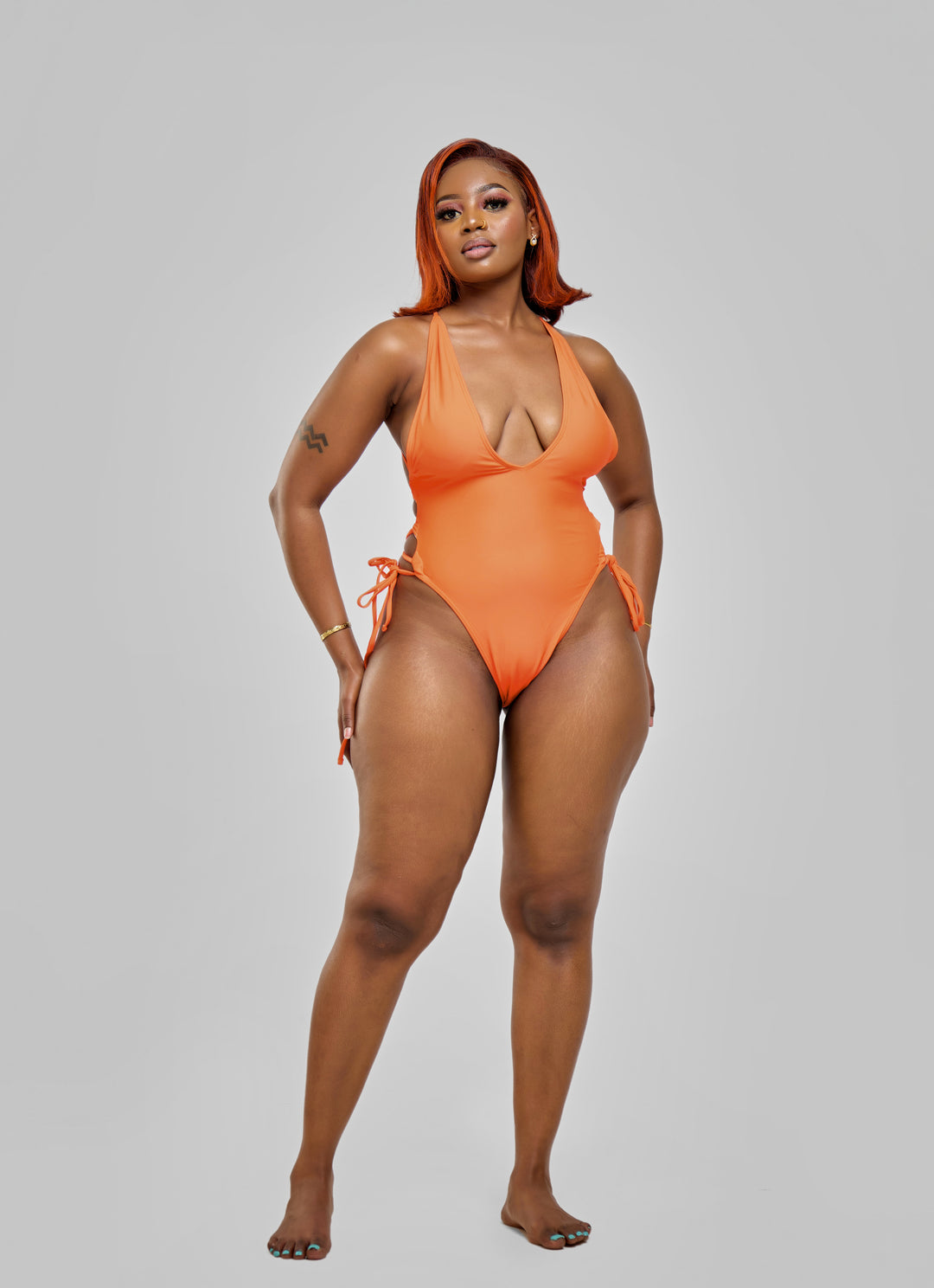 Orange one piece with drawstrings